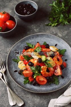 Food & Drink: Salad of large shrimp squid cherry tomatoes cucumbers dried olives with arugula parsley and bal #14390 Photo