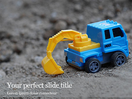 무료 파워포인트 템플릿 - toy backhoe on the sand, 무료 파워 포인트 템플릿, 16461, 공익 사업/공업 — PoweredTemplate.com