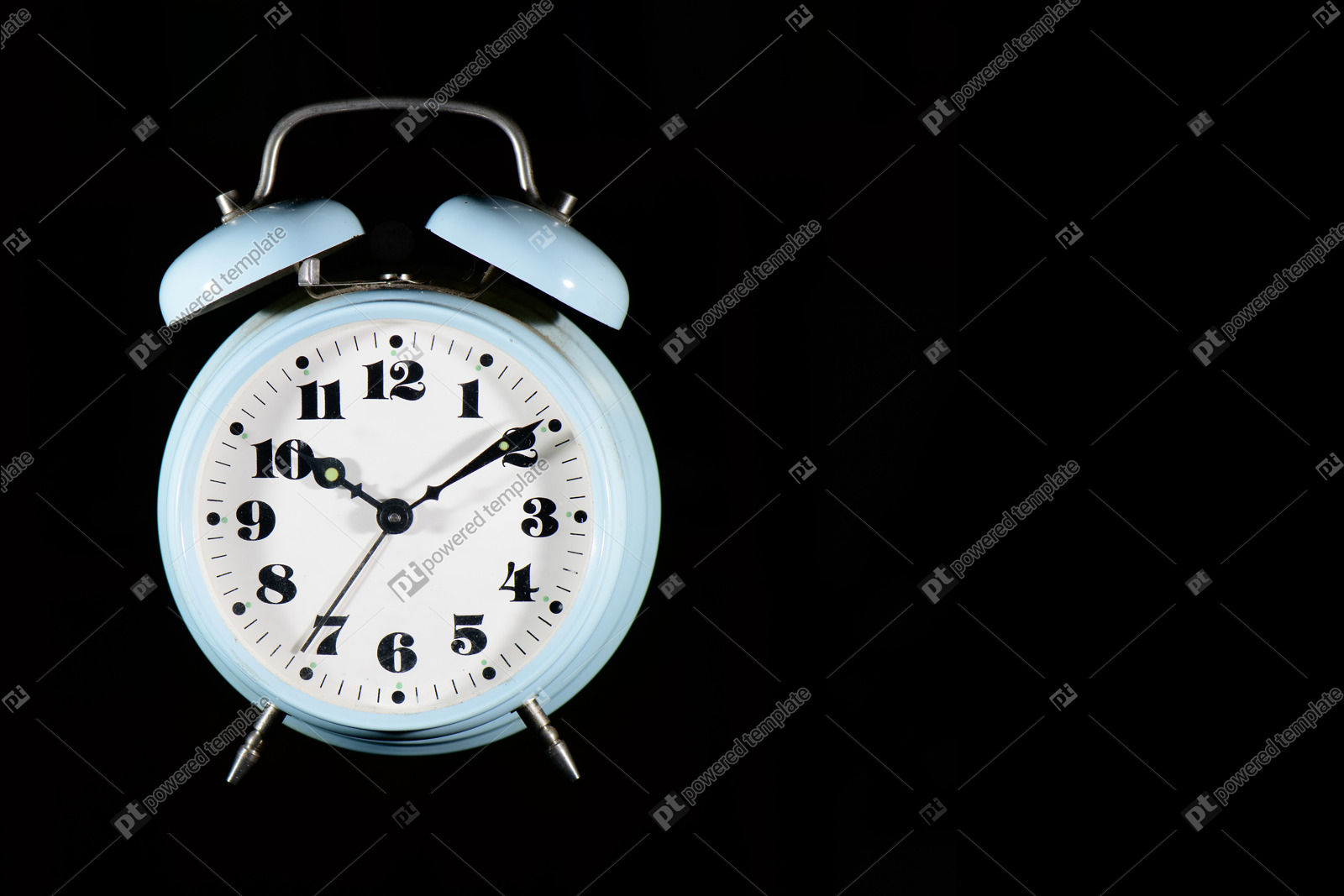 Classic Table Alarm Clock in Light Blue Color on a Black Background